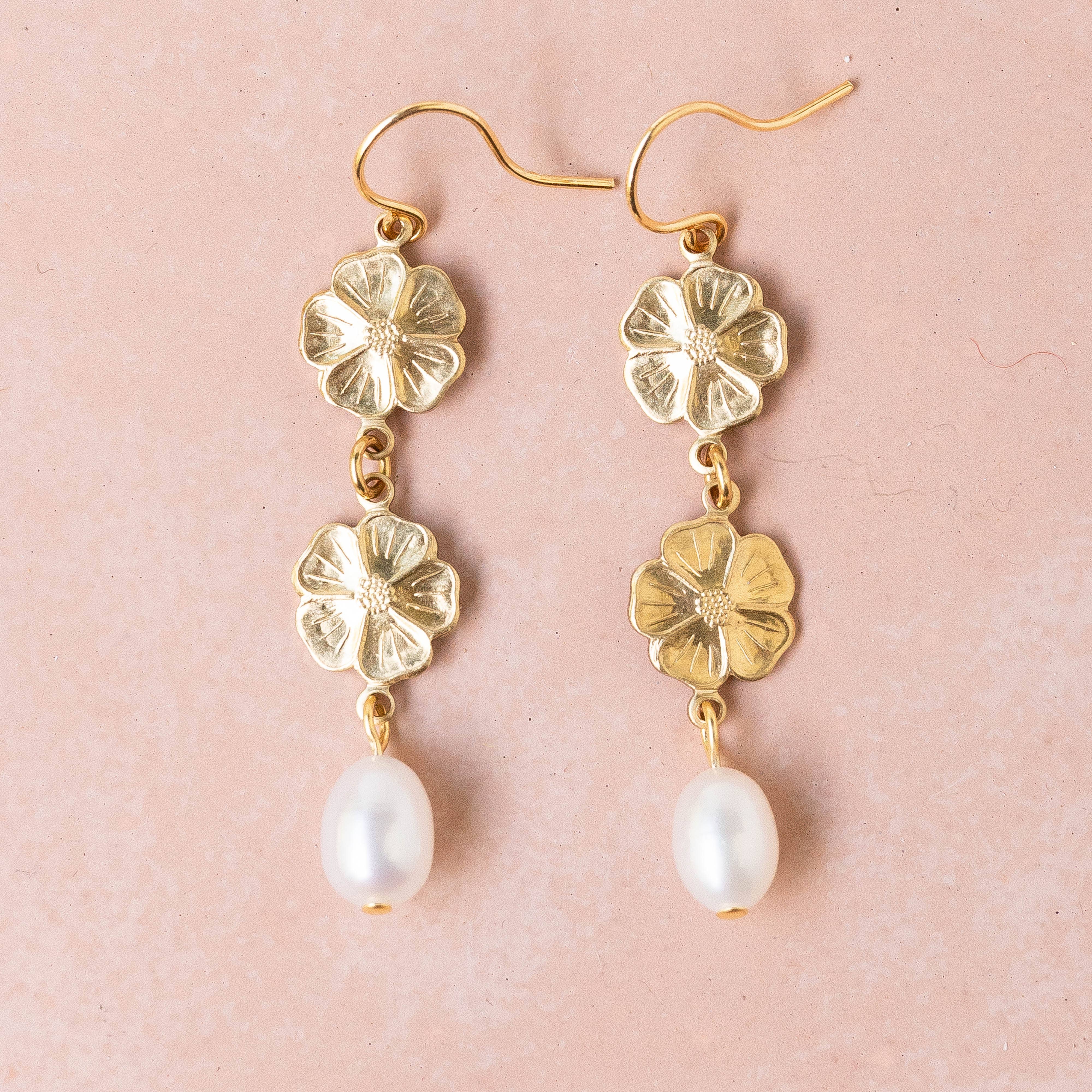 Pearl and two flower dangle earrings